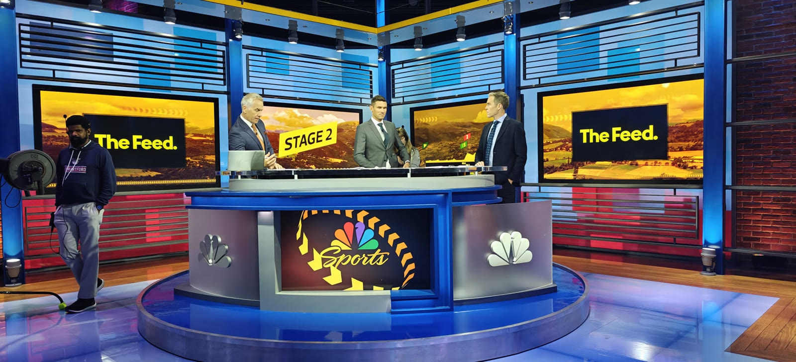 NBC Sports Tour de France studio — analysts at the desk with the Sandbox AR table