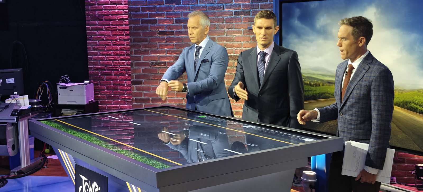 Three NBC analysts working the Sandbox AR road table on air